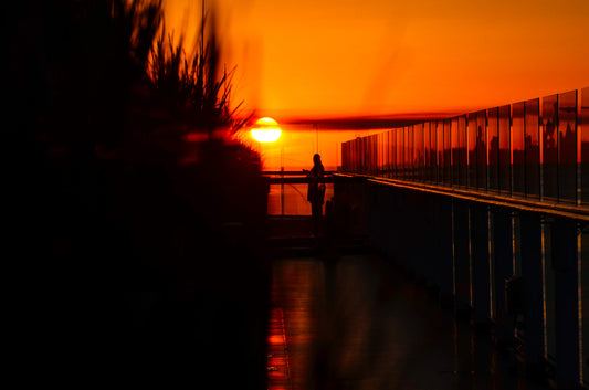 Heavy Sunset Silhouette On Cruise Ship